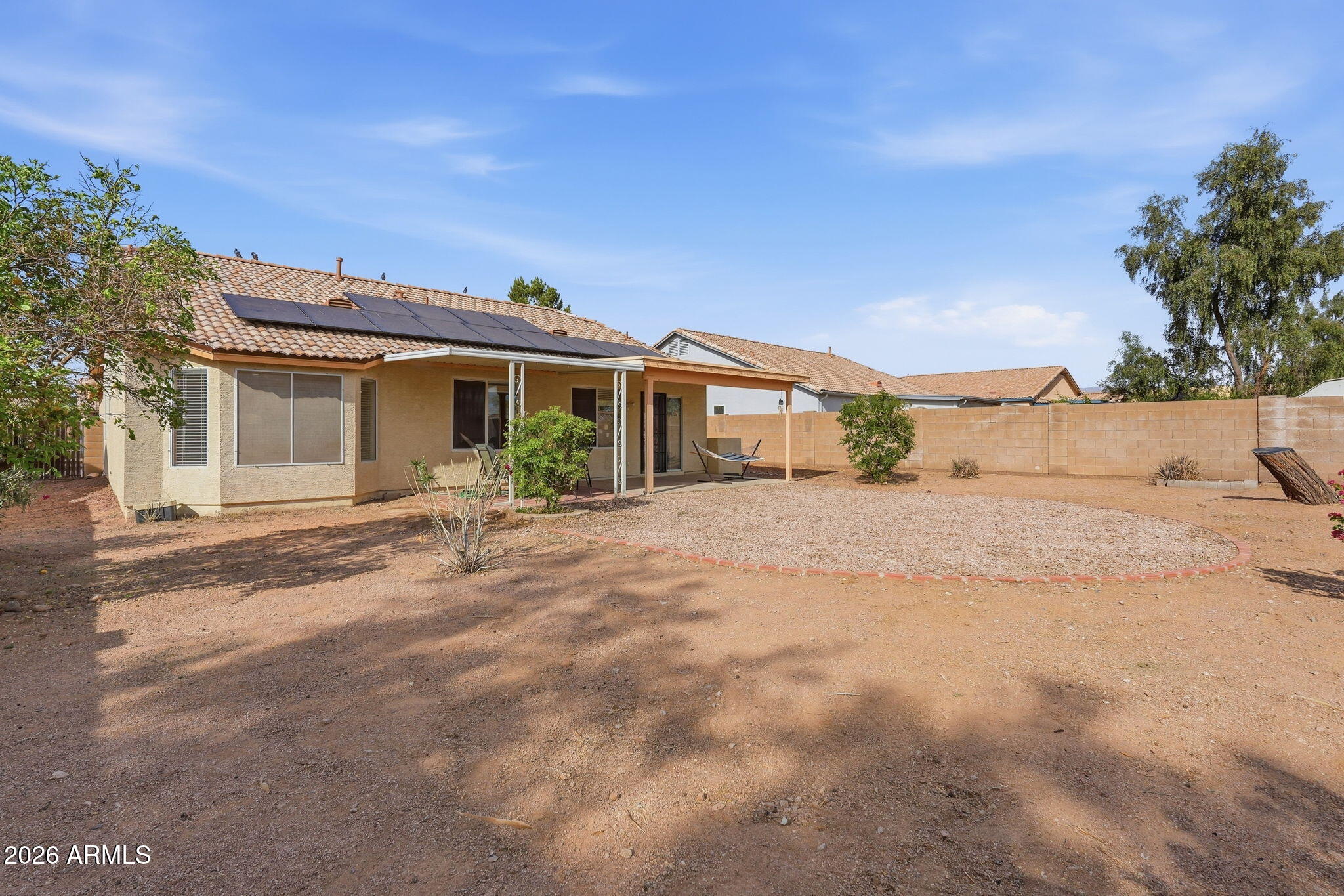 1405 West 15th Lane Apache Junction, AZ 85120 - Photo 31 of 33 a front view of a house with a yard
