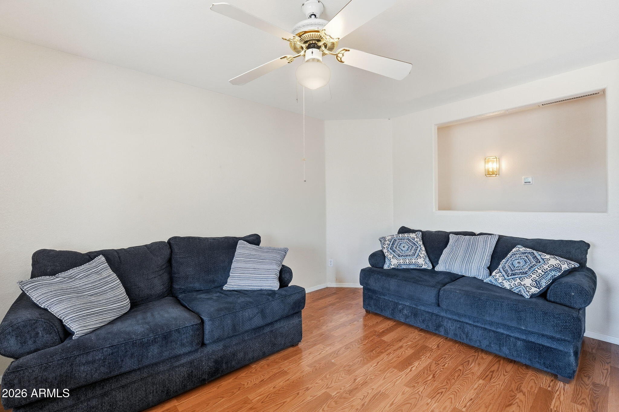 1405 West 15th Lane Apache Junction, AZ 85120 - Photo 9 of 33 a living room with a couch