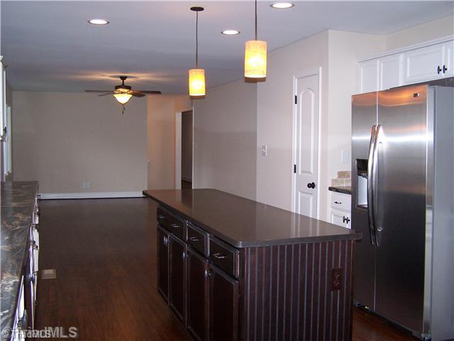 1067 Cantering Road High Point, NC 27262 - Photo 8 of 25 Kitchen. Another view of the kitchen that looks into the den area.