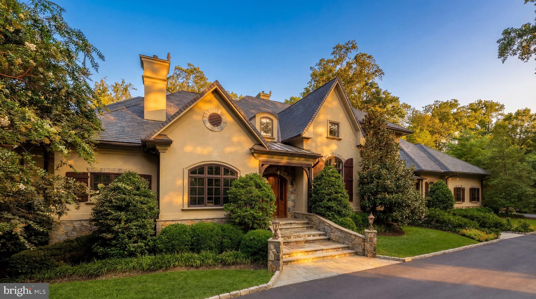 9250 Persimmon Tree Road Potomac, MD 20854 - Photo 1 of 47 a front view of a house with a yard