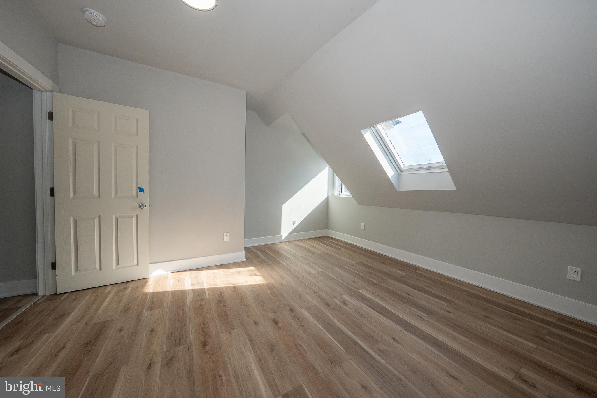 122 East 3rd Street, Unit 3 Pottstown, PA 19464 - Photo 29 of 35 a view of an empty room and wooden floor
