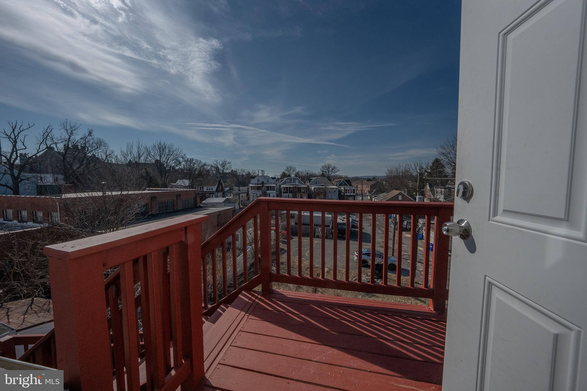 122 East 3rd Street, Unit 3 Pottstown, PA 19464 - Photo 32 of 35 a balcony with wooden floor and city view