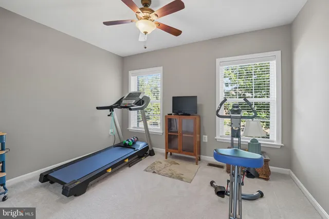 a room with gym equipment and a window