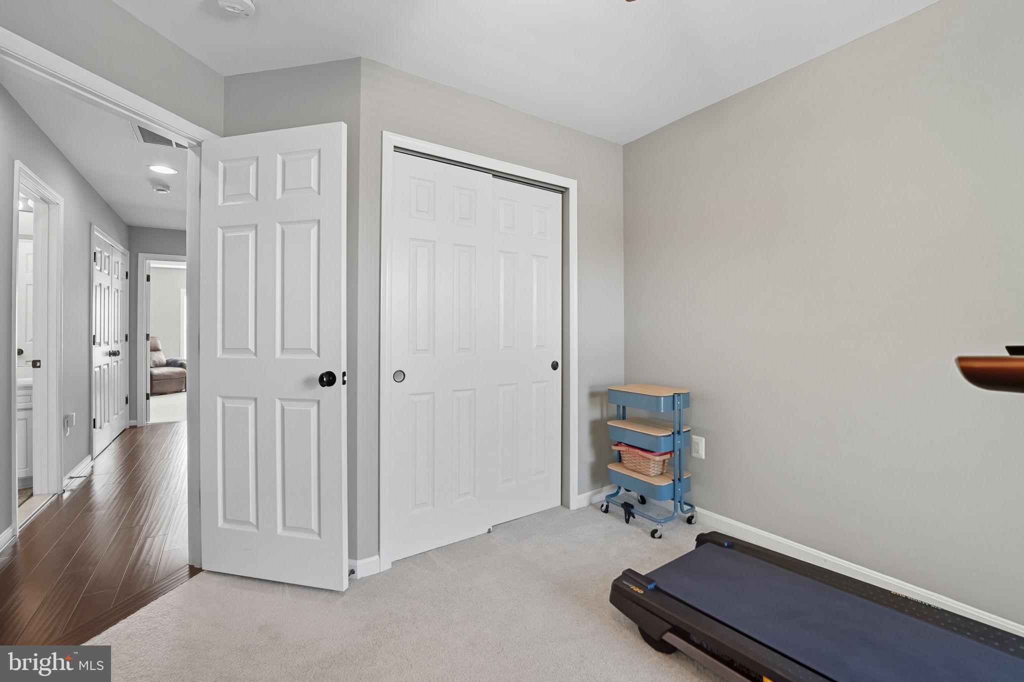 4316 Chain Bridge Road Fairfax, VA 22030 - Photo 16 of 33 a room with gym equipment and wooden floor