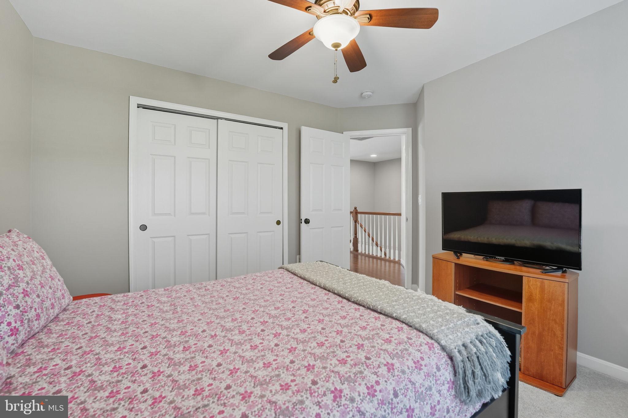 4316 Chain Bridge Road Fairfax, VA 22030 - Photo 18 of 33 a bedroom with a bed and a flat screen tv