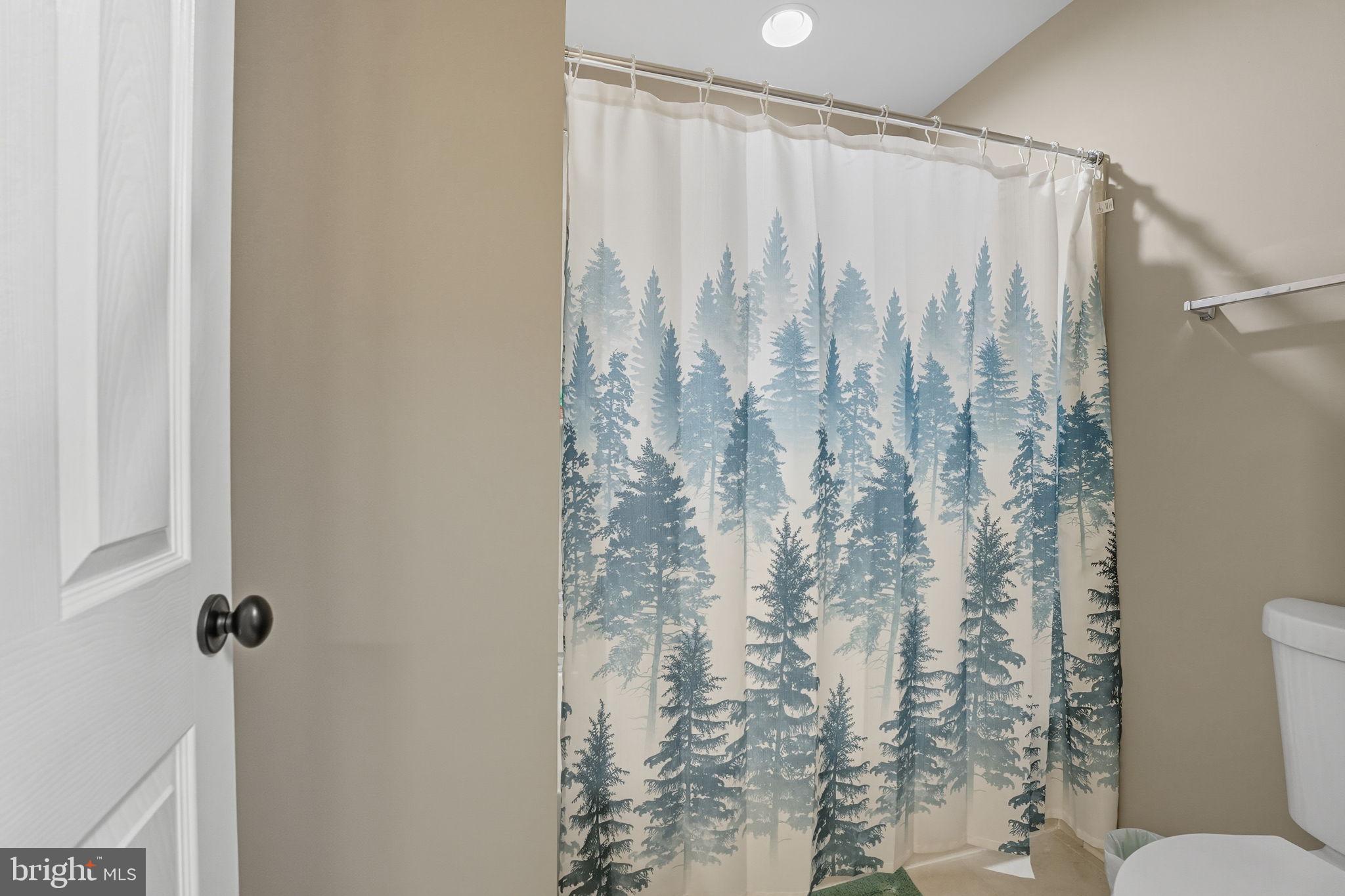 4316 Chain Bridge Road Fairfax, VA 22030 - Photo 20 of 33 a bathroom with a shower curtain and a toilet