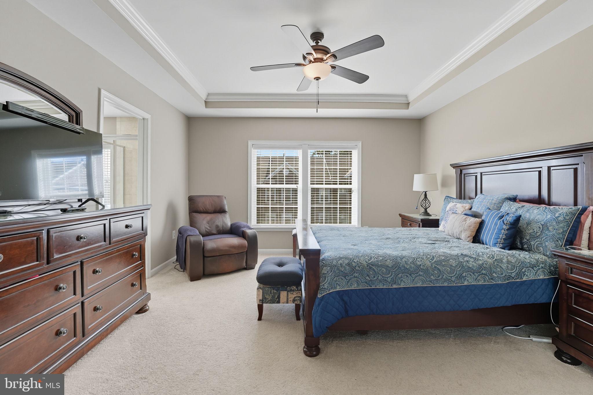 4316 Chain Bridge Road Fairfax, VA 22030 - Photo 21 of 33 a spacious bedroom with a bed and a couch