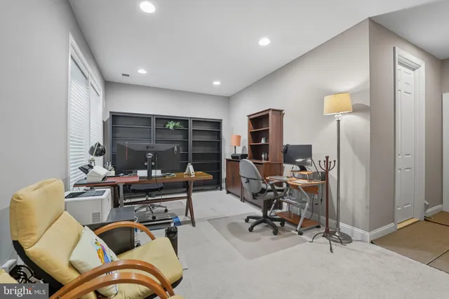 a view of a livingroom with furniture and a window