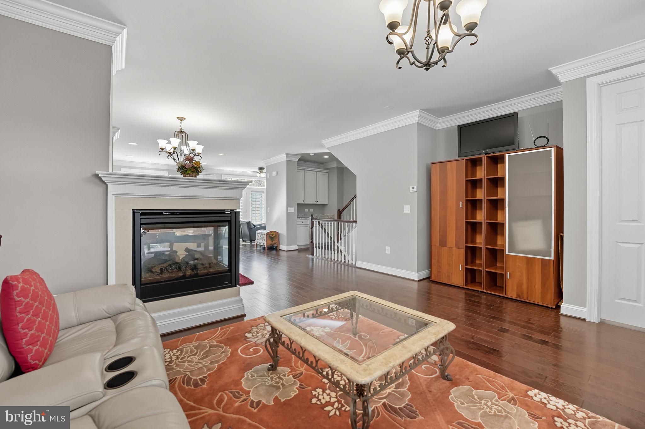 4316 Chain Bridge Road Fairfax, VA 22030 - Photo 4 of 33 a living room with furniture and a fireplace