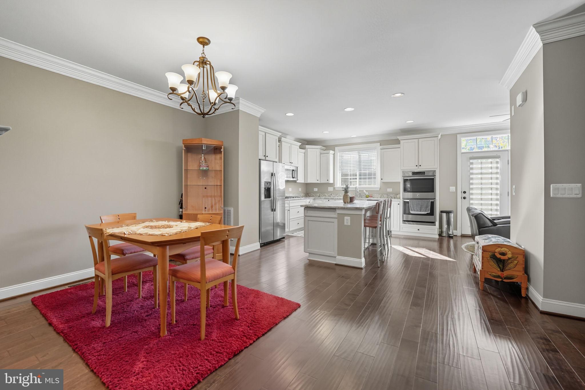 4316 Chain Bridge Road Fairfax, VA 22030 - Photo 5 of 33 a view of a dining room with furniture and wooden floor