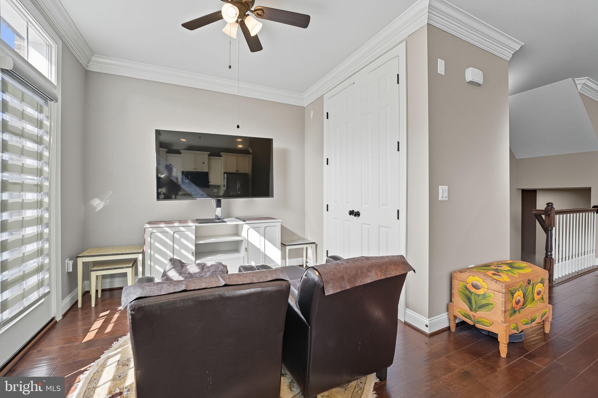 4316 Chain Bridge Road Fairfax, VA 22030 - Photo 10 of 33 a living room with furniture a flat screen tv and a window