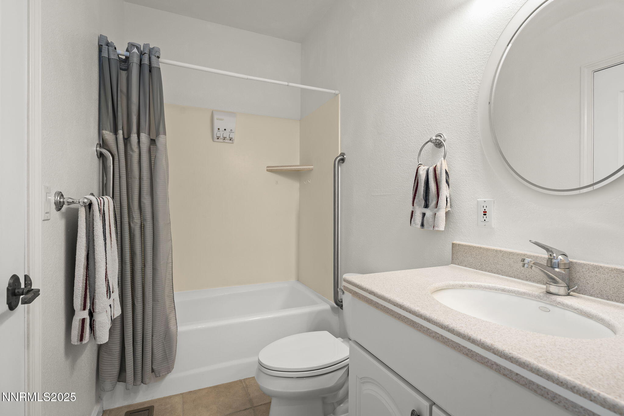 5700 Twin Springs Road Reno, NV 89510 - Photo 23 of 48 a bathroom with a granite countertop sink toilet and shower
