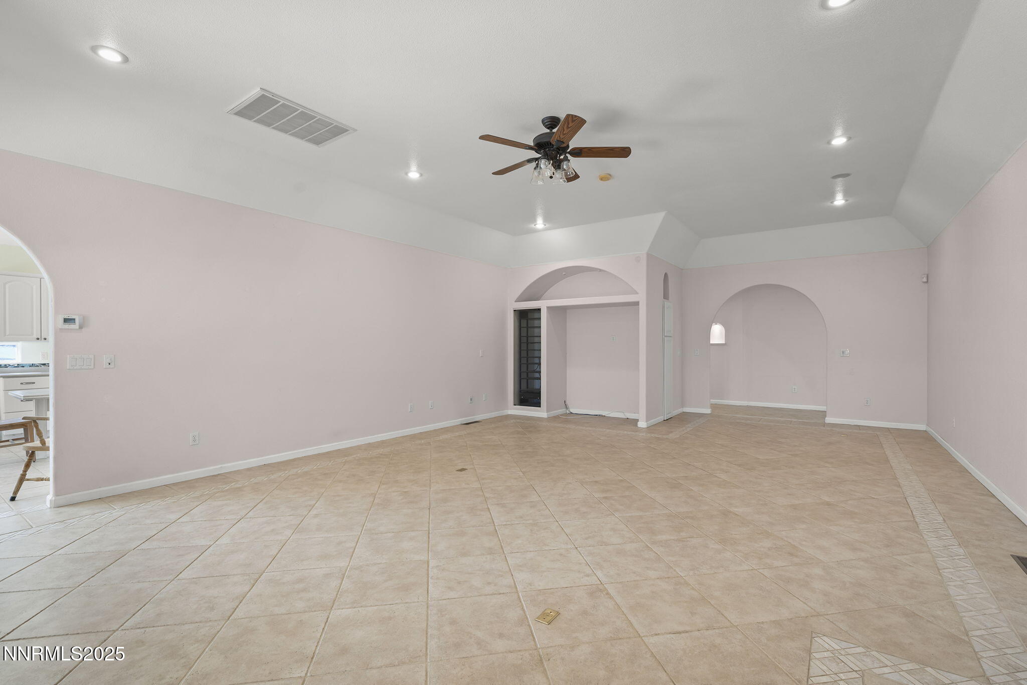 5700 Twin Springs Road Reno, NV 89510 - Photo 8 of 48 an empty room with a empty space and a ceiling fan