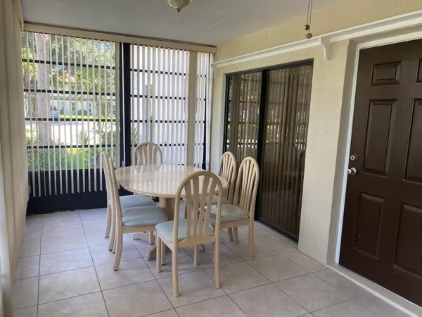 a view of a room with furniture and window