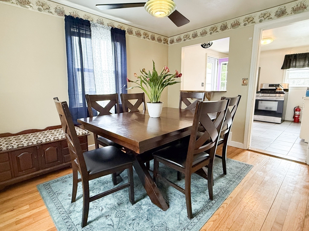 27 Cranmore Road Boston, MA 02136 - Photo 11 of 29 a view of a dining room with furniture and wooden floor