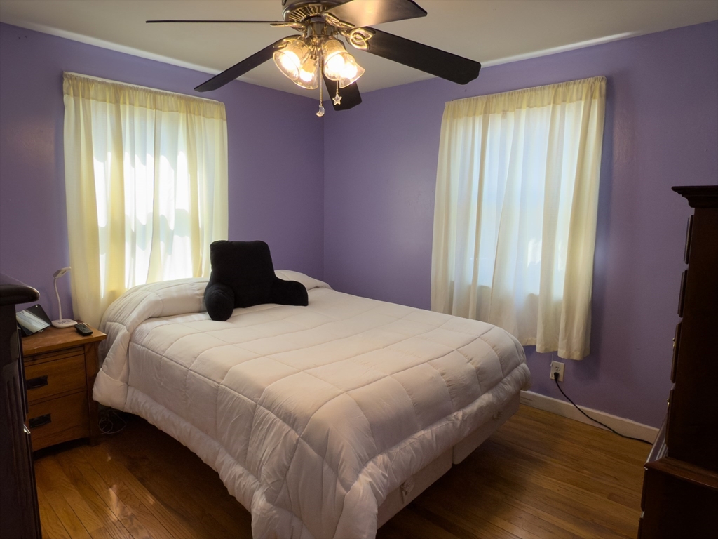 27 Cranmore Road Boston, MA 02136 - Photo 13 of 29 a bedroom with a bed and a chandelier