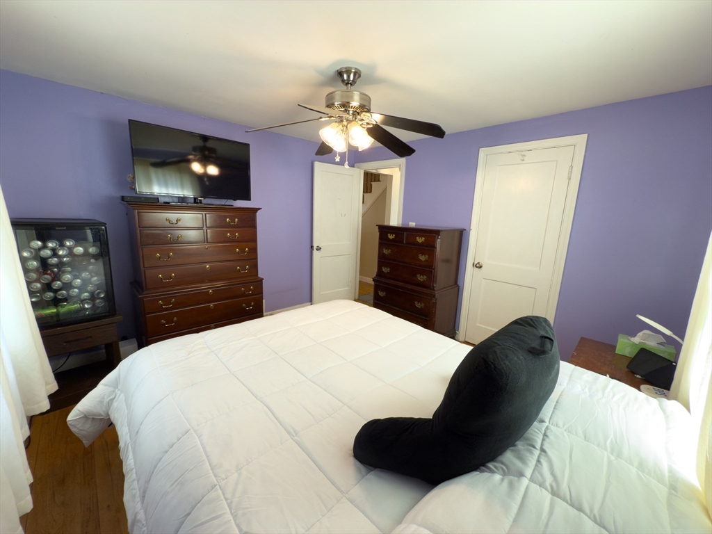 27 Cranmore Road Boston, MA 02136 - Photo 14 of 29 a bedroom with a bed and a dresser