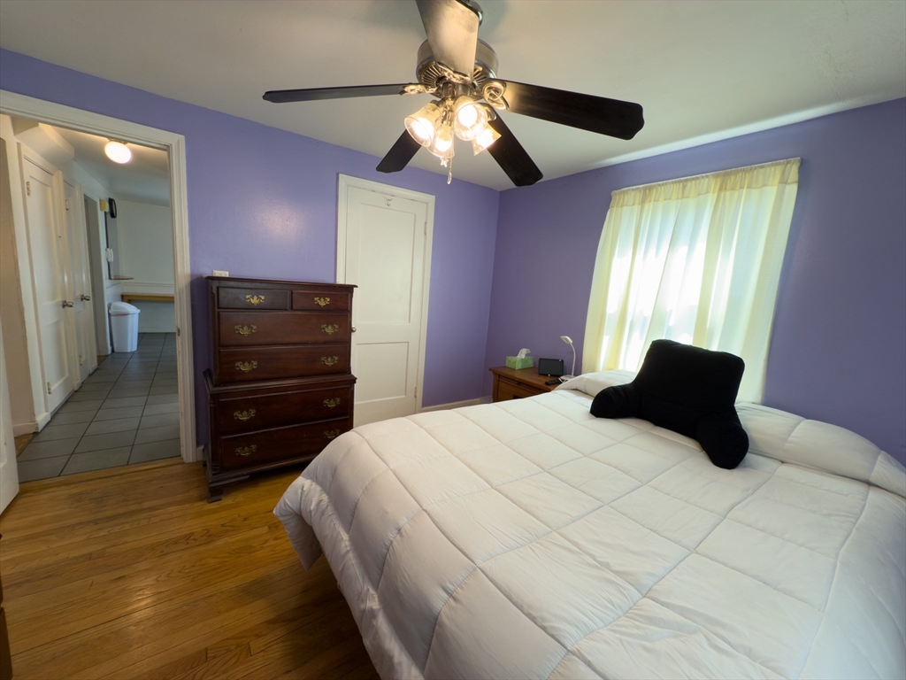 27 Cranmore Road Boston, MA 02136 - Photo 15 of 29 a bedroom with a bed and a chandelier