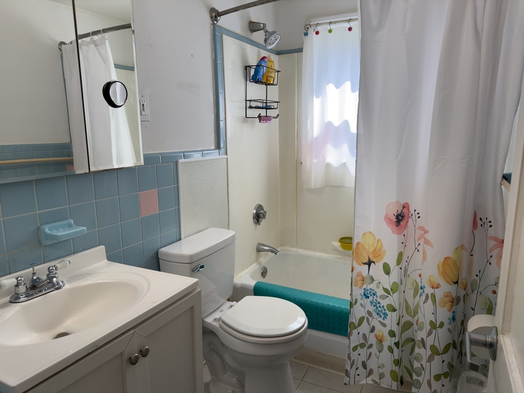 27 Cranmore Road Boston, MA 02136 - Photo 16 of 29 a bathroom with a sink toilet and shower