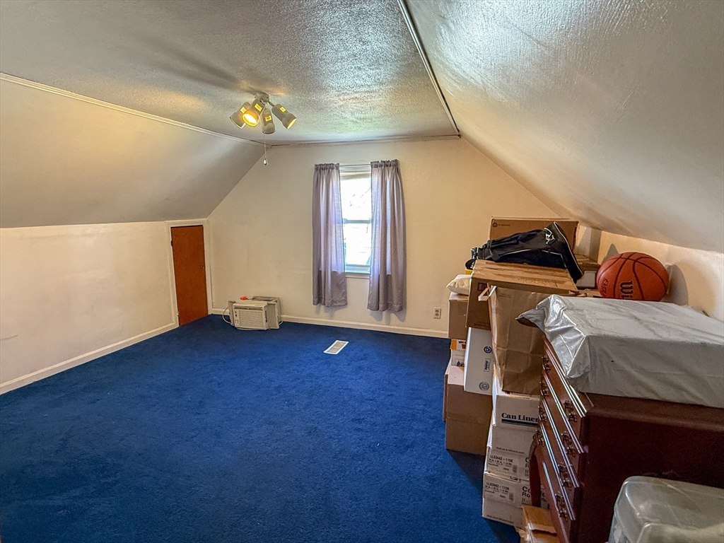 27 Cranmore Road Boston, MA 02136 - Photo 22 of 29 a view of an empty room with wooden floor and a window