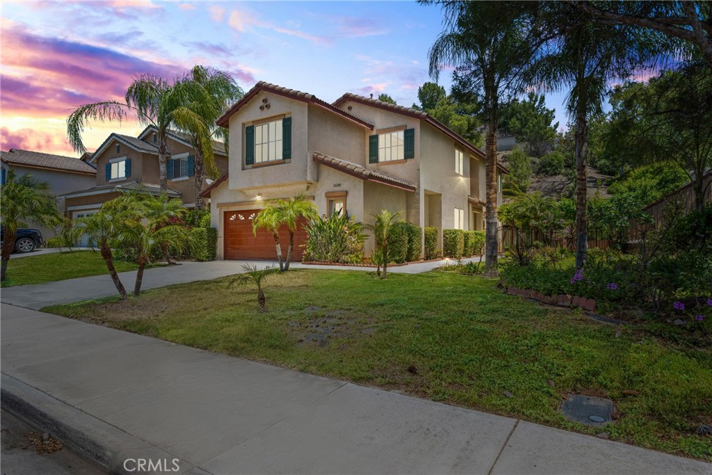 16200 Setting Sun Circle Riverside, CA 92503 - Photo 1 of 41 a front view of a house with a garden