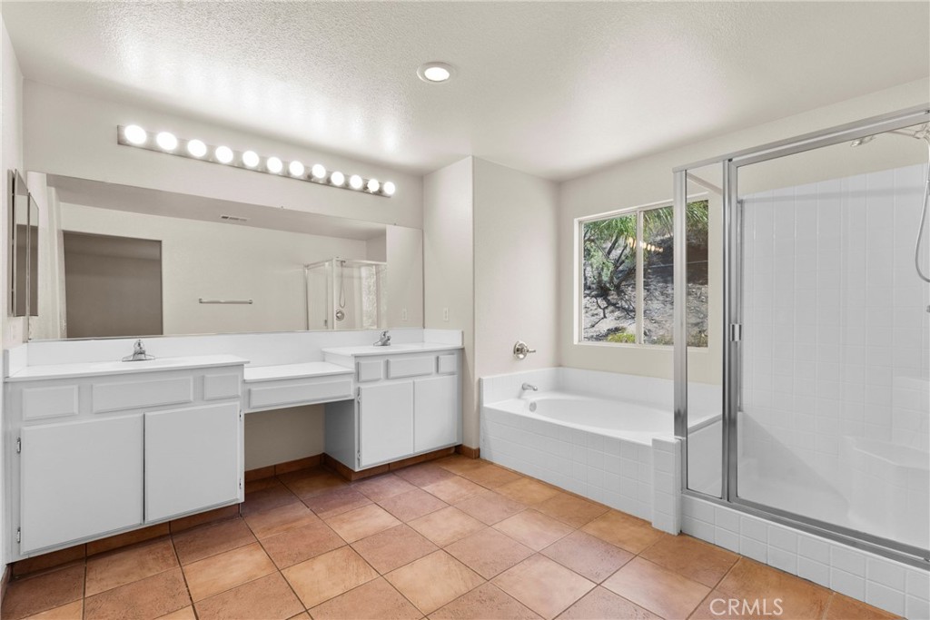 16200 Setting Sun Circle Riverside, CA 92503 - Photo 18 of 41 a bathroom with a tub sink and mirror