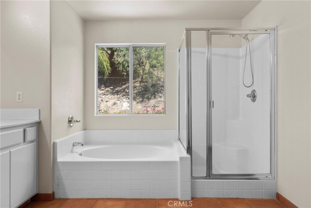 16200 Setting Sun Circle Riverside, CA 92503 - Photo 20 of 41 a bathroom with bathtub and shower