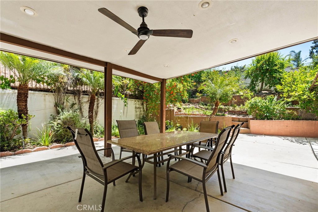 16200 Setting Sun Circle Riverside, CA 92503 - Photo 29 of 41 a view of a patio with a table chairs and garden