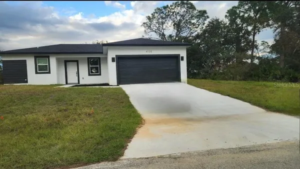 a front view of a house with yard