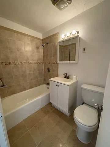 a bathroom with a sink a toilet and a bathtub