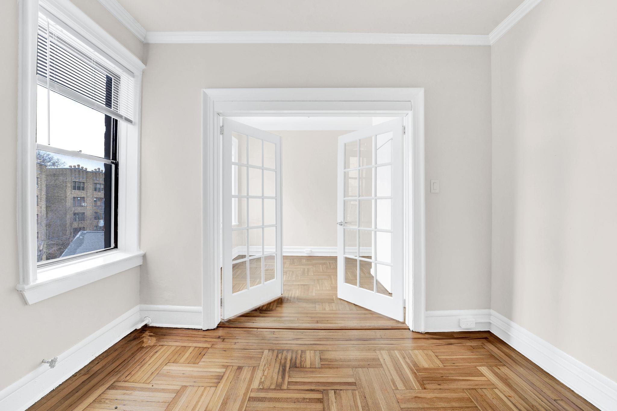 275 Harrison Avenue, Unit E5 Jersey City, NJ 07304 - Photo 13 of 17 a view of empty room with wooden floor and fan