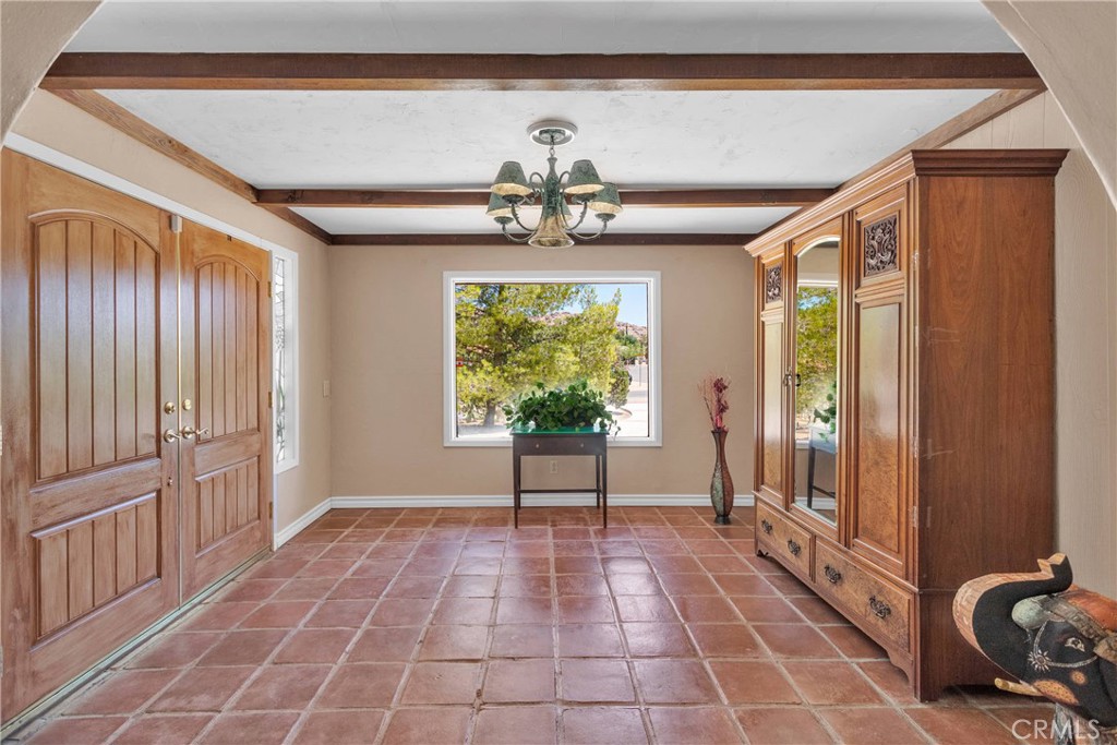 19955 Chickasaw Road Apple Valley, CA 92307 - Photo 6 of 60 a view of a livingroom with a chandelier and wooden floor