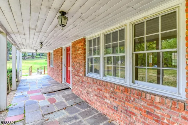 a front view of a house with a large window