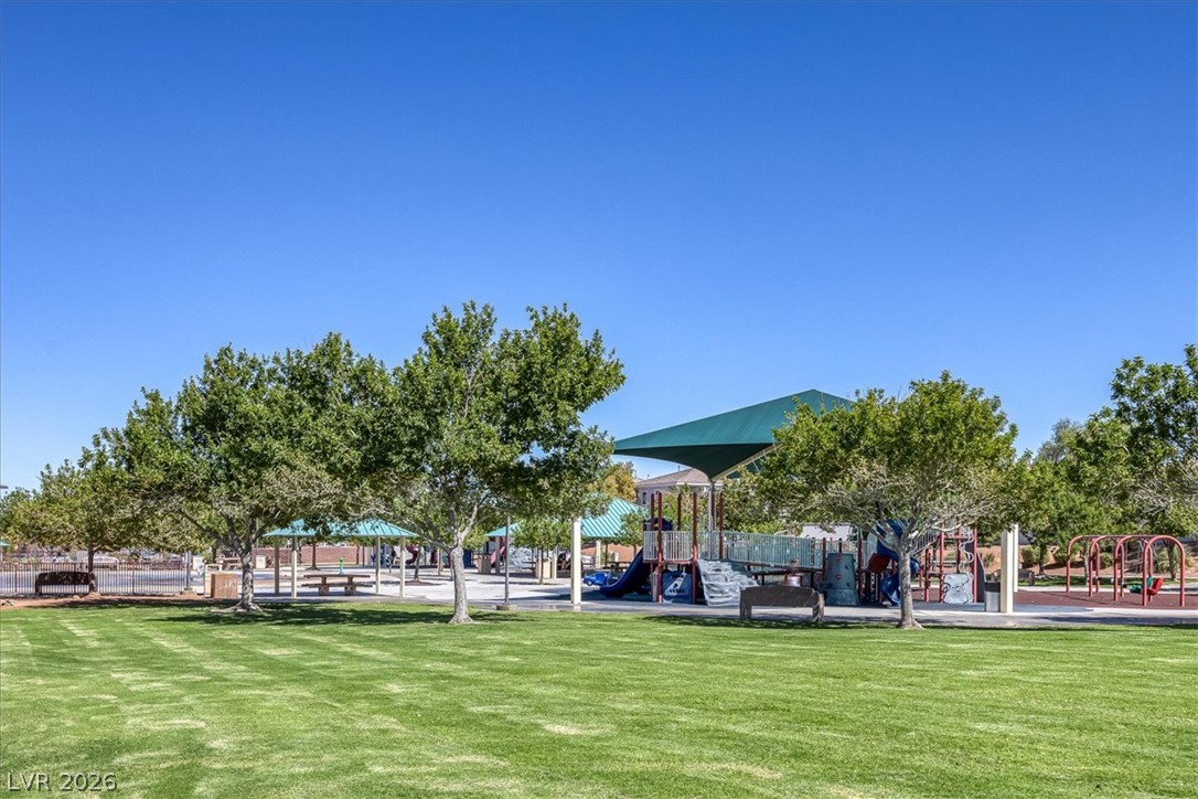 251 Integrity Ridge Drive Henderson, NV 89052 - Photo 32 of 32 Mature trees shade a spacious community park equipped with modern playground structures.
