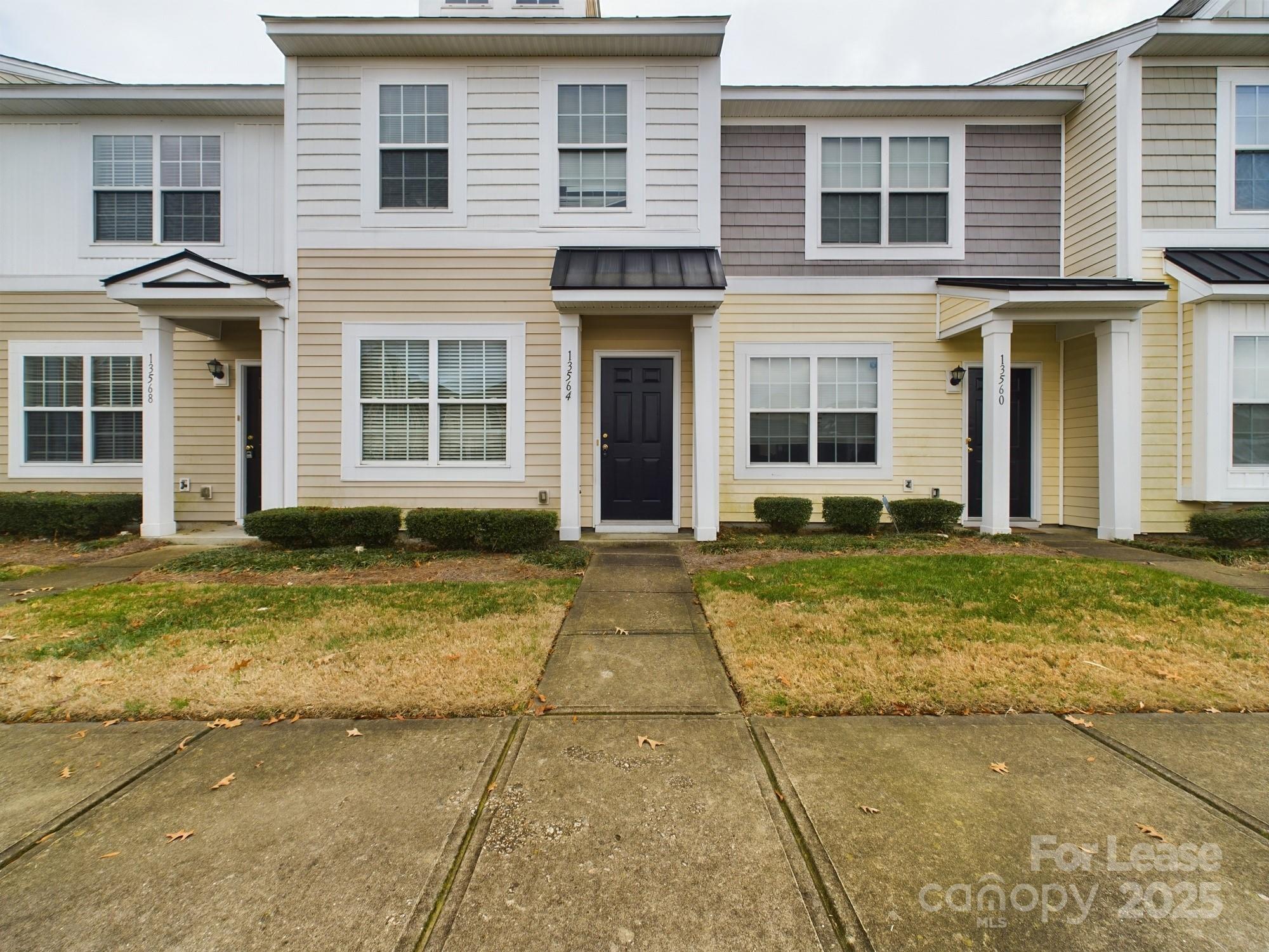 13564 Calloway Glen Drive Charlotte, NC 28273 - Photo 1 of 15 a view of a brick house with many windows