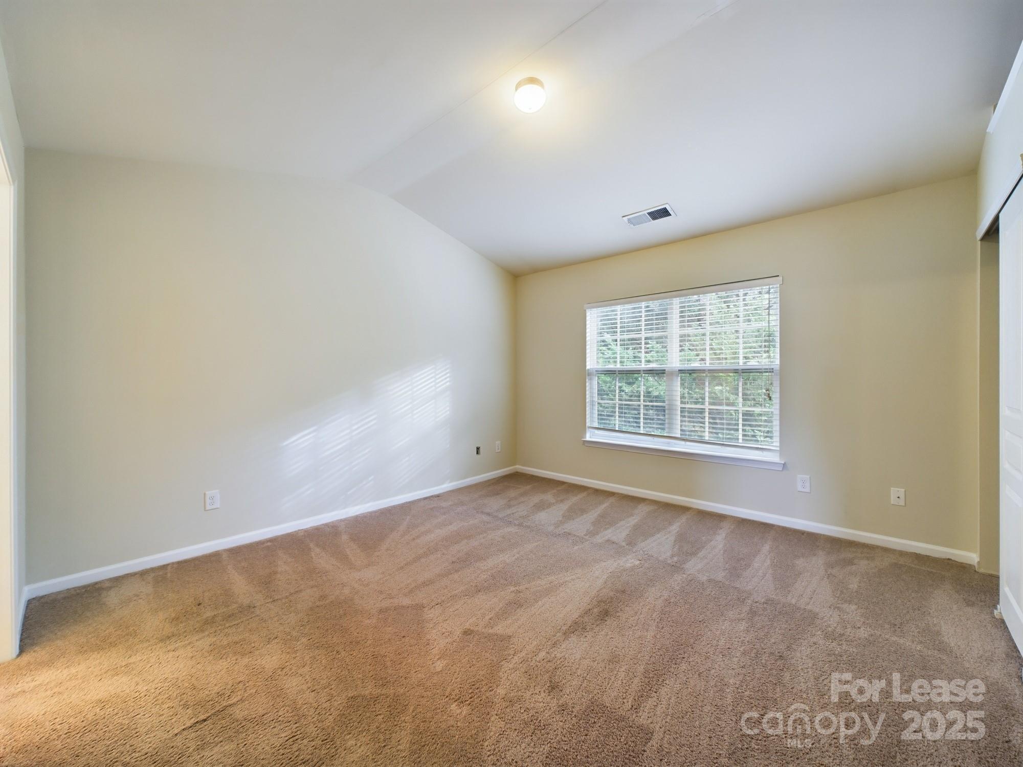 13564 Calloway Glen Drive Charlotte, NC 28273 - Photo 12 of 15 an empty room with a window