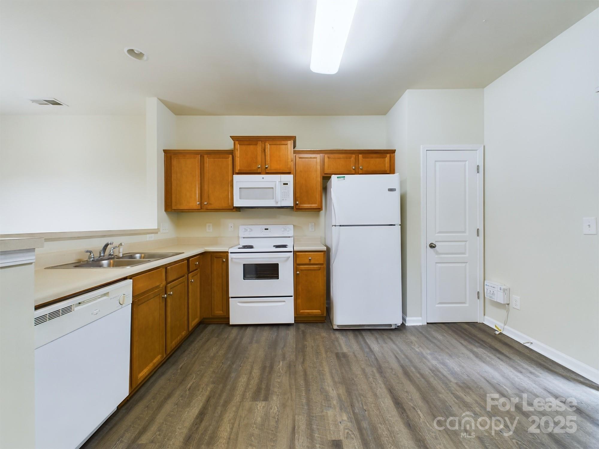 13564 Calloway Glen Drive Charlotte, NC 28273 - Photo 4 of 15 a kitchen with stainless steel appliances granite countertop a refrigerator a stove and a sink