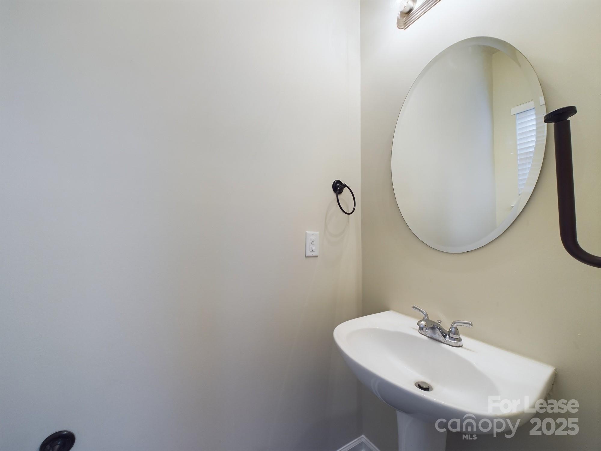 13564 Calloway Glen Drive Charlotte, NC 28273 - Photo 5 of 15 a bathroom with a sink and a mirror