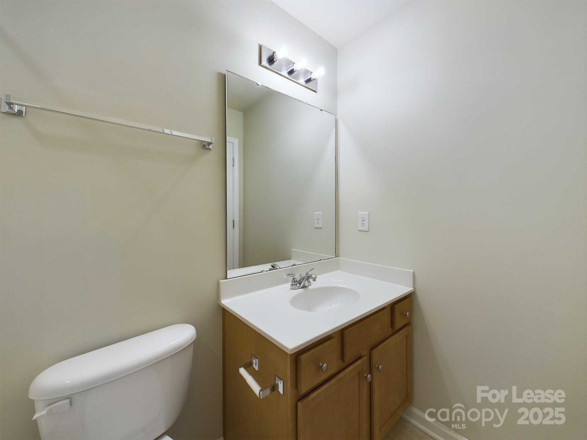 13564 Calloway Glen Drive Charlotte, NC 28273 - Photo 9 of 15 a bathroom with a sink toilet and vanity