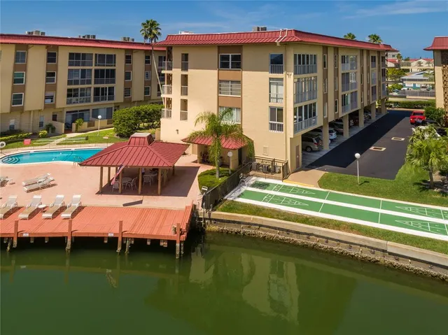 a backyard of a house with yard and outdoor seating