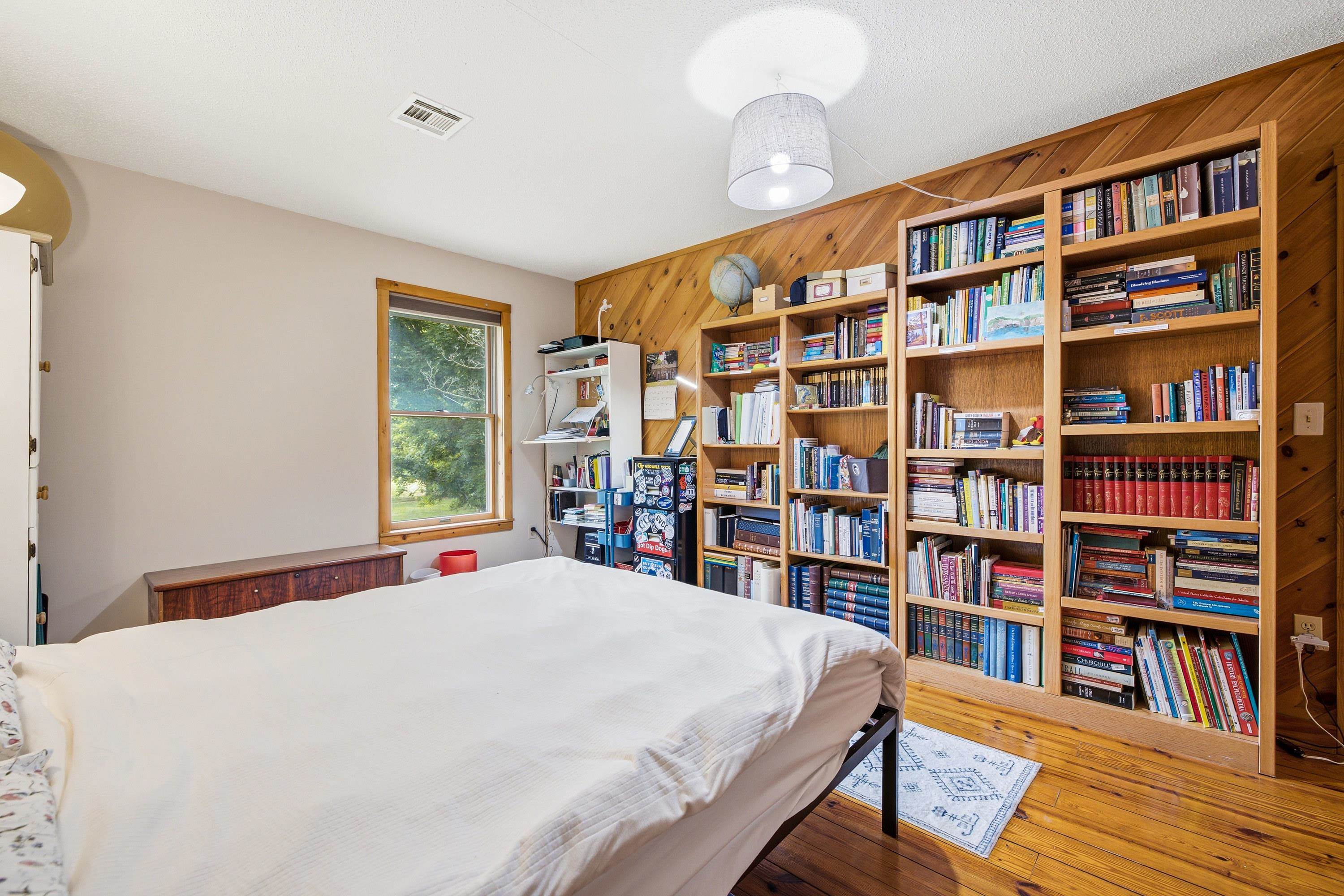 3980 Greenmount Road Harrisonburg, VA 22802 - Photo 37 of 75 This additional bedroom on the upper level of the home features hardwood flooring and an abundance of built-in shelving.