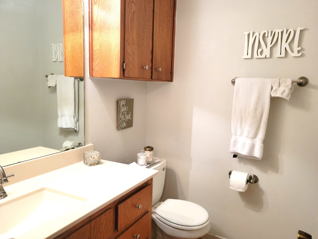 6904 Argonne Forest Cove, Unit A Austin, TX 78759 - Photo 17 of 25 a bathroom with a sink toilet and vanity