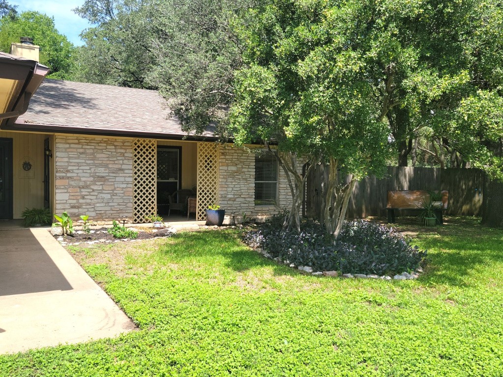 6904 Argonne Forest Cove, Unit A Austin, TX 78759 - Photo 2 of 25 a view of a house with backyard and sitting area