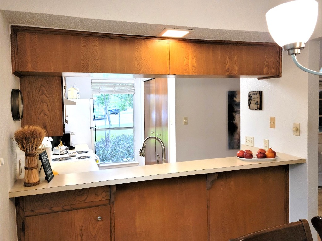 6904 Argonne Forest Cove, Unit A Austin, TX 78759 - Photo 7 of 25 a bathroom with a sink and a mirror