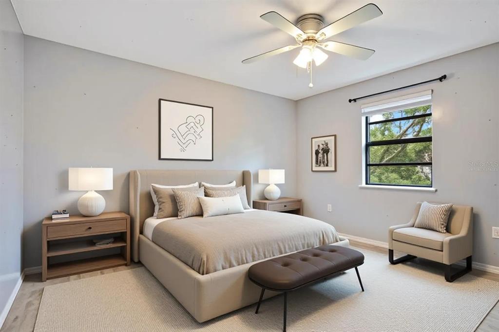 5785 Gilliam Road Orlando, FL 32818 - Photo 68 of 100 a bedroom with a bed and a couch