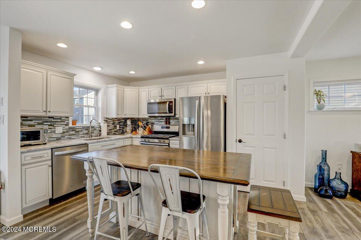 45 Vanard Drive Brick, NJ 08723 - Photo 15 of 52 a kitchen with stainless steel appliances granite countertop a refrigerator and a stove top oven