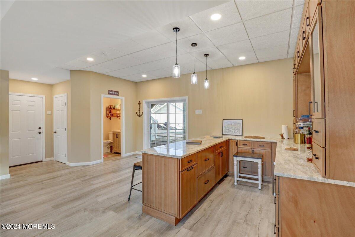 45 Vanard Drive Brick, NJ 08723 - Photo 32 of 52 a kitchen with stainless steel appliances kitchen island granite countertop a stove a sink and a refrigerator
