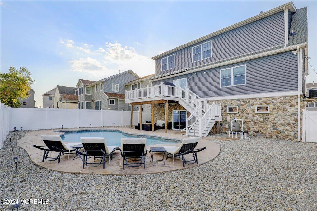 45 Vanard Drive Brick, NJ 08723 - Photo 40 of 52 a view of a patio with table and chairs and potted plants