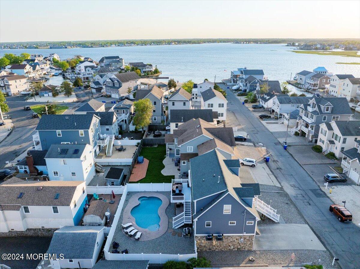 45 Vanard Drive Brick, NJ 08723 - Photo 45 of 52 an aerial view of a city with lots of residential buildings and ocean view in back