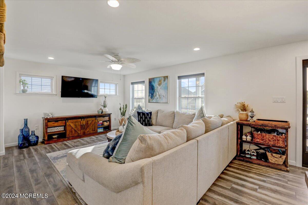 45 Vanard Drive Brick, NJ 08723 - Photo 8 of 52 a living room with furniture and a flat screen tv